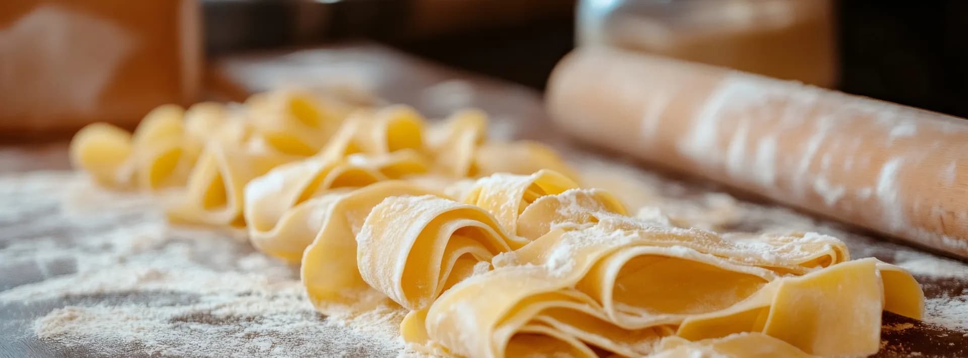 ribbons of uncooked, handmade pappardelle pasta 