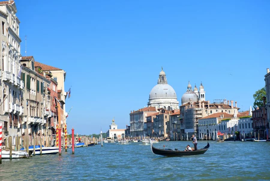 A gondola gliding along the Grand Canal in Venice, Italy.