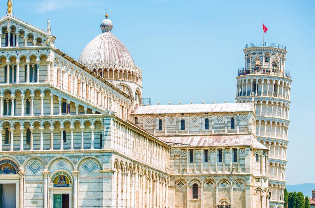 the leaning tower of Pisa with the cathedral in the foreground in Pisa, Italy