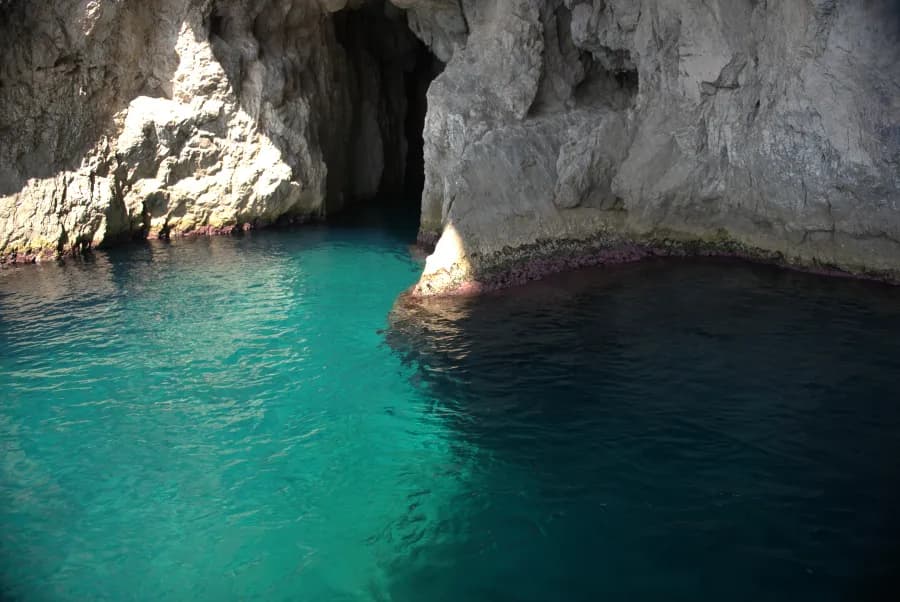 Capri's aquamarine waters and entrance to one of her many caves